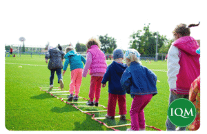 A group of children having a movement break outside