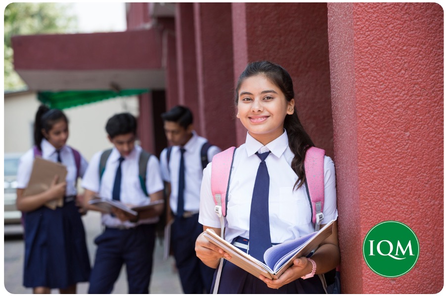 A pupil at an international school in Dubai, smiling for the picture