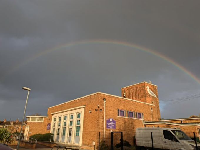 A photo of a rainbow over the Northfield St. Nicholas School building