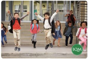 International school children having fun outside of their school in the UAE