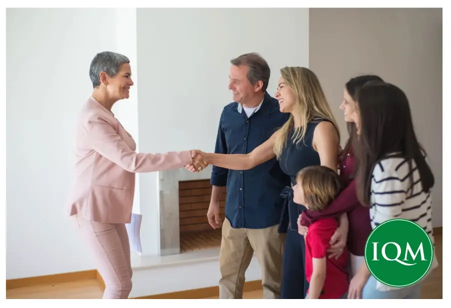 Family meeting school head teacher in their home