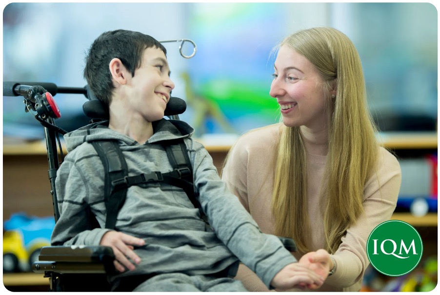 A pupil with SEND sharing his views and opinions with a teacher