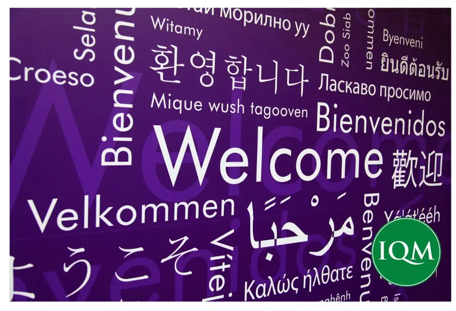 Wall sign saying welcome in many different languages