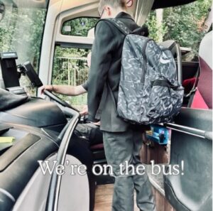An image of a child travelling to school on the busy for the first day